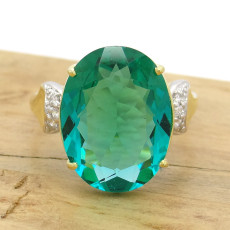 Anel Oval com Cristal de Turmalina Paraíba e 6 Diamantes, em Ouro Amarelo 18 Kilates