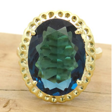 Anel Trabalhado com London Blue Oval, em Ouro Amarelo 18 Kilates